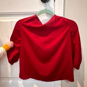 Red blouse with bow in the back